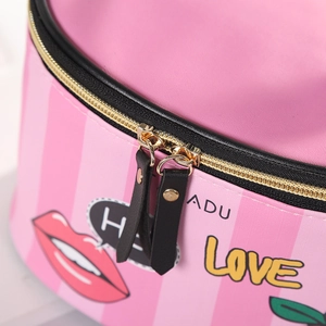 Pink striped PU cylinder makeup bag with creative spray painting and gold zipper detail