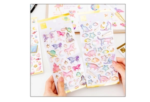 Detail of bronzing unicorn and cat crystal stickers for DIY scrapbooking and planners