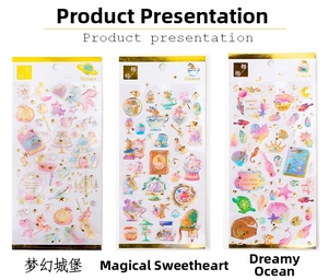 Detail view of gold foiled stickers featuring dream castle, magic heart, and ocean themes