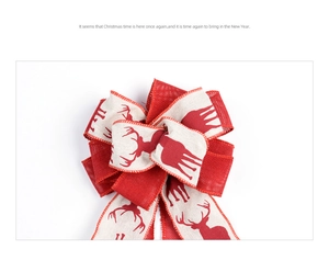 Detail of burlap Christmas bow with red reindeer print and stitched edges for tree topper