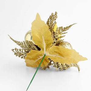 Golden artificial Christmas branch with spruce needles, pine cones and shiny ornaments