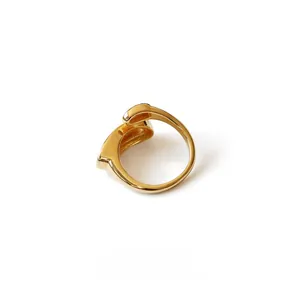 Macro shot of 18K gold-plated oval pea ring with minimalist water drop geometric design