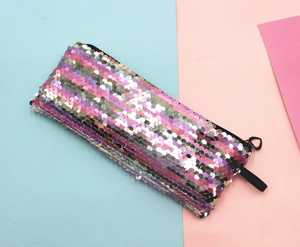 Top view of a rectangular mermaid sequin pencil case with heart-shaped zipper pull