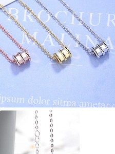 Detailed close-up showing rose gold, gold and silver waist-shaped ring pendant necklaces
