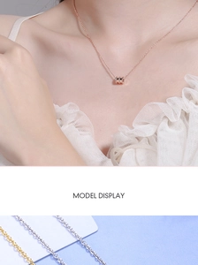 Detail view of dainty cylindrical waist pendants in rose gold, gold and silver finishes