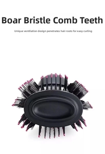 Detail of professional hair brush featuring boar bristles and unique airflow vents