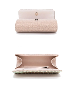 Detail of champagne gold rhinestone evening bag showing interior space and magnetic closure