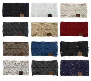 Selection of 12 colors of women's cable knit headbands with leather MOK logo labels