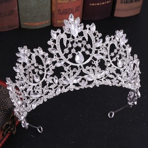 Detailed close-up of luxury Baroque bridal crown with silver metal and clear rhinestones