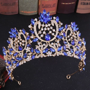 Detailed macro of Baroque bridal crown with blue and white crystals on golden base