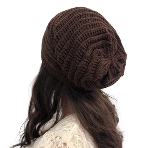 Detailed back view of women's dark brown slouchy beanie with spiral knit pattern