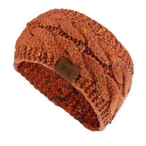 Detail of chunky knit ear warmer with twist braid texture and faux leather MOK label
