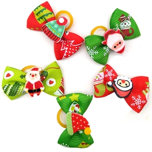 Christmas dog hair bows set with Santa and snowflake patterns on ribbed ribbons