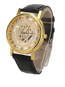 Detail view of fashion watch with skeleton dial gold case and black leather strap