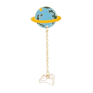Detailed view of enamel cat and planet chain brooch with blue and green continents
