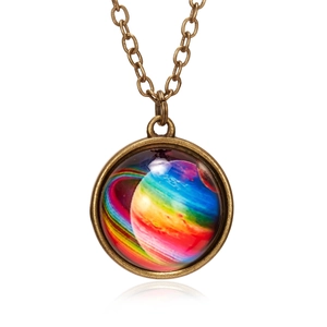 Detailed view of vintage bronze galaxy pendant with a glowing nebula cosmic pattern