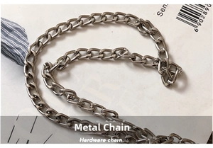 Detail shot of the polished silver metal chain strap for the guitar shoulder bag