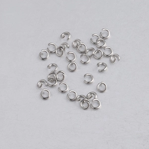 Macro detail of bulk silver stainless steel open jump rings for DIY jewelry making
