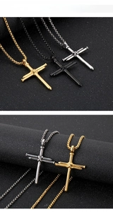 Detailed view of punk cross pendant made of intertwined steel nails in three metal finishes