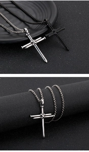 Detail showing titanium steel nail cross pendants in silver and black industrial style