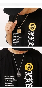 Detailed view of punk wolf head pendant necklaces in gold and silver finishes