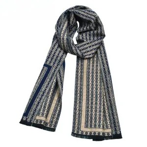 Detail of navy blue and off-white geometric jacquard scarf with fringe edges