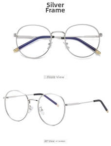 Macro detail of retro round metal glasses frame in silver with anti-blue light lenses