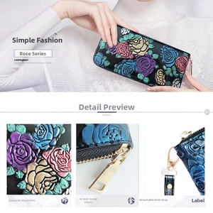 Close-up of golden zipper and floral embossing on long wallet with detachable wrist strap