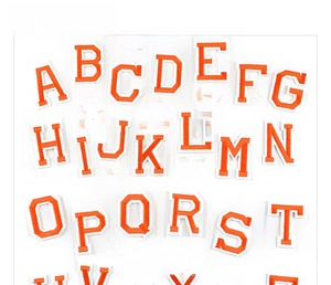 Detailed set of orange embroidered letter patches from A to Z with white border edges