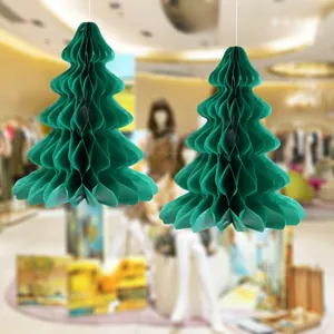Detail of two-piece dark green honeycomb paper Christmas tree ornaments for festive hanging