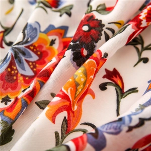 Detail of bohemian floral print on breathable cotton fabric with vintage patterns
