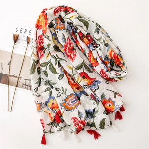 Lightweight cotton linen shawl with colorful floral print and red fringe for summer travel