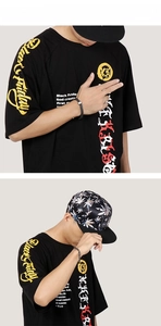 Detail show of men black street style T-shirt with Black Friday graphic and artistic print