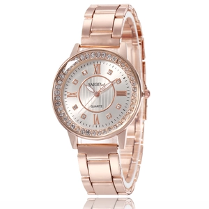 Montre à quartz élégante pour femme en or rose avec lunette en strass et cadran étoilé