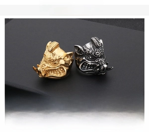 Detailed spec view of vintage stainless steel wild boar rings in gold and silver finish