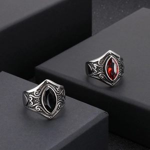 Vintage stainless steel ring with marquise-cut ruby and black stone in carved design