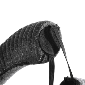 Detail of black leather texture and high-elastic strap on the adjustable horn headrest