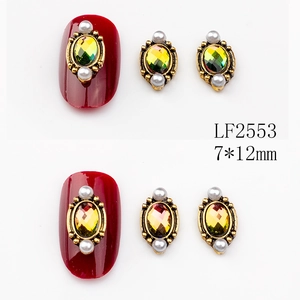 Detail of 7x12mm oval alloy nail art charms with vintage gold border and small pearls