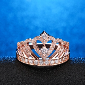 Elegant rose gold crown ring featuring micro-paved diamonds and hollow heart design