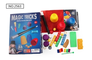 Detailed magic trick set showing magic wand, cups, instruction manual and accessories