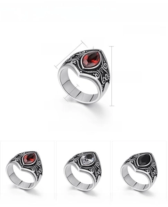 Macro detail of men's stainless steel ring showing red marquise zircon and dimensions