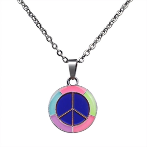 Close-up of a silver peace sign pendant with colorful enamel and mood-changing effects