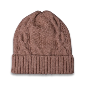 Close-up of winter knit beanie showing cable knit texture and ribbed cuff in dusty pink