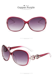 Detail of copper purple oversized sunglasses featuring gradient lenses and metal buckle hinges