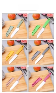 Close-up of stainless steel fruit knives with ergonomic handles and ventilated covers