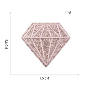 Detailed view of rose gold diamond embroidery patch with sequins and dimension markings