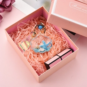 Ocean theme acrylic shell keychain with blue starfish and laser strap in a gift box