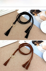 Detail of hand-woven waist ropes with metal rings and tassels in black and brown