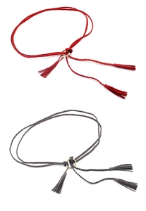 Close-up of hand-woven red and gray waist ropes with golden alloy rings and tassels