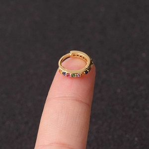 Macro view of a gold-plated micro-pave hoop earring set with colorful zircon stones